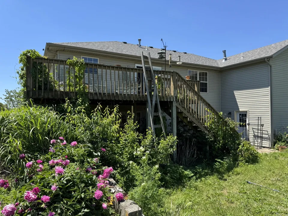 The original elevated deck before removal and exterior preparation.