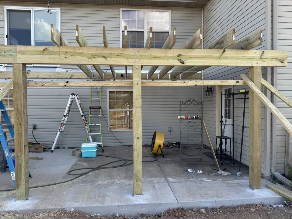 A wider view of the outdoor framing work.