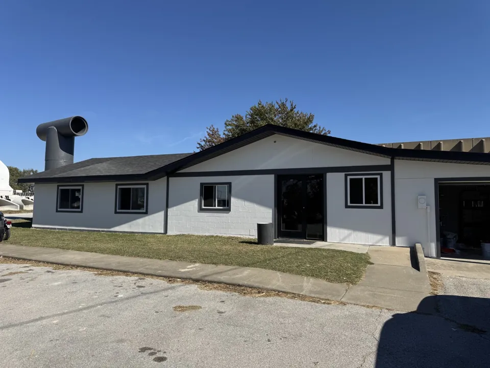 The updated Scurlock Office exterior with white walls and dark trim.