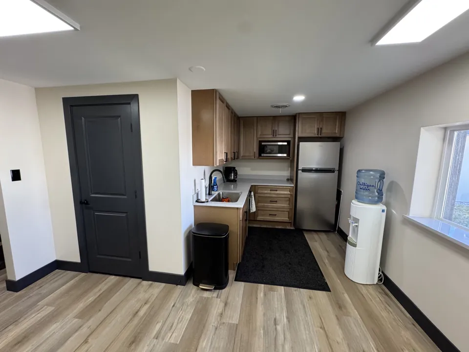 The updated office kitchenette and cabinets.